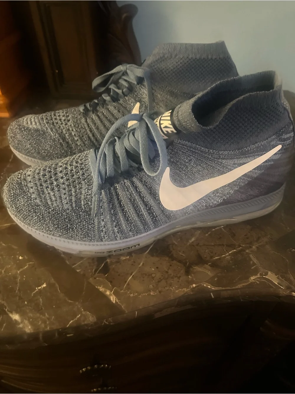 Nike Men’s Blue Flyknit Mid-Top Sneakers with White Swoosh